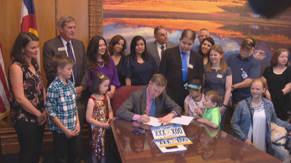 cancer plate bill signg bb raw 1 concatenated 143927 frame 4671 Cancer Survivor Drives “Cure Childhood Cancer” License Plate Campaign