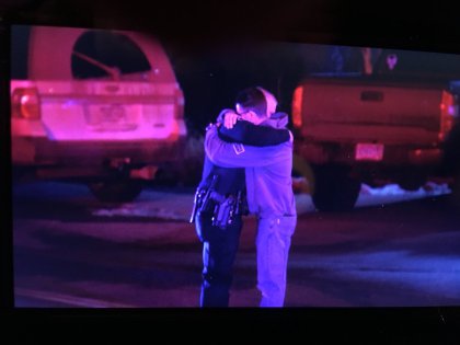 abeyta officers embracing Hundreds Of Officers Participate In Procession For Fallen Adams County Deputy