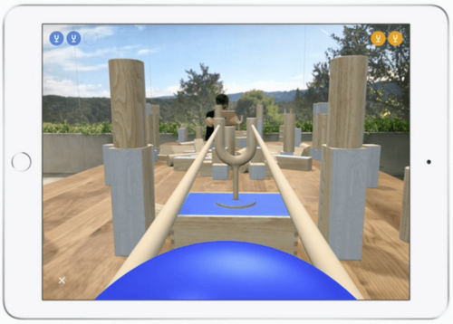 Another multiplayer game, with AR objects on top of real objects. Seen from Player Two's tablet. (Image from Apple)